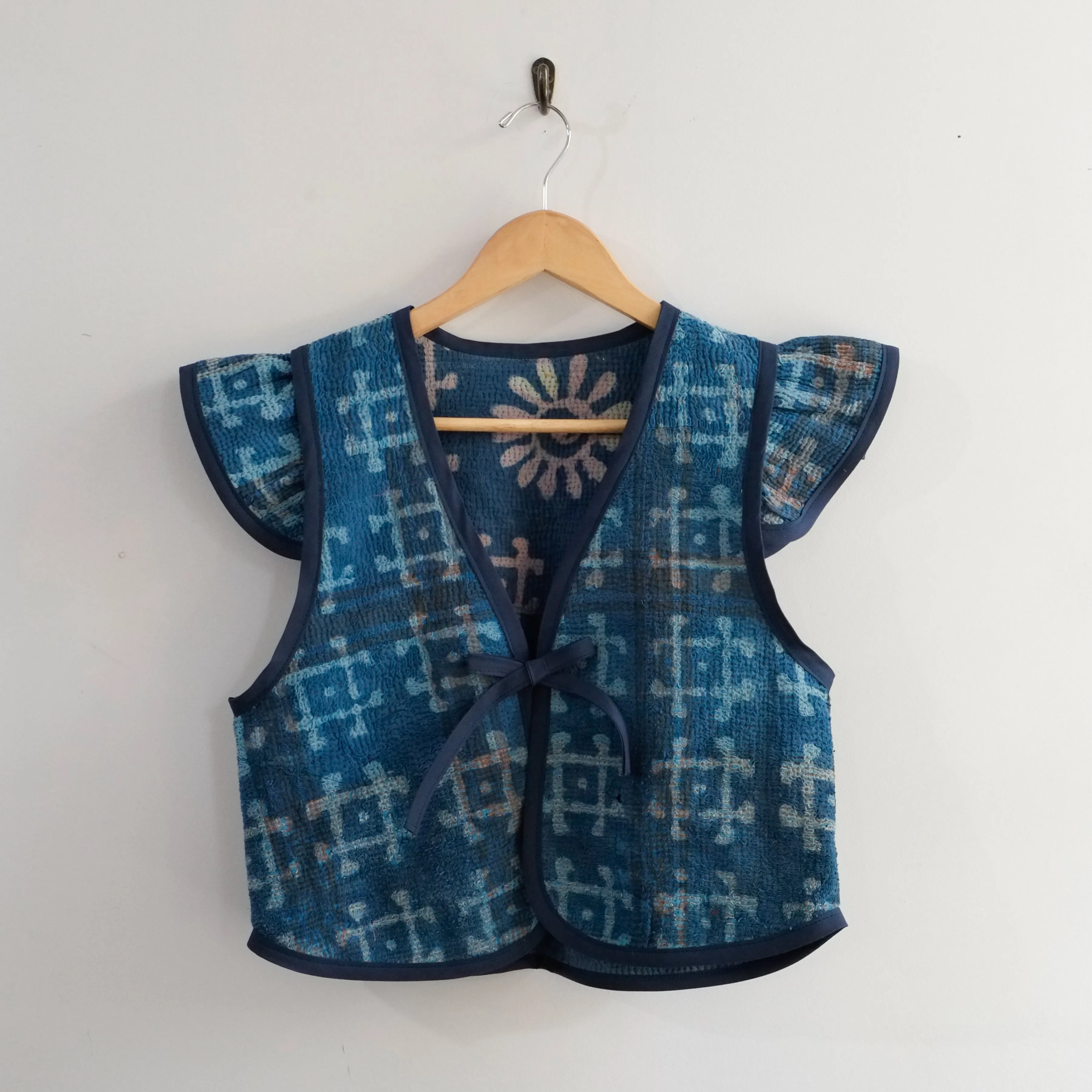 Amelia Flutter Sleeve Vest Indigo with Pound Symbol XS009